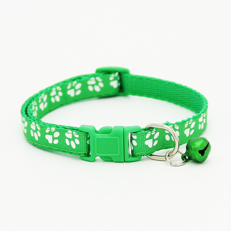 The pet cat wears a bell collar Green S